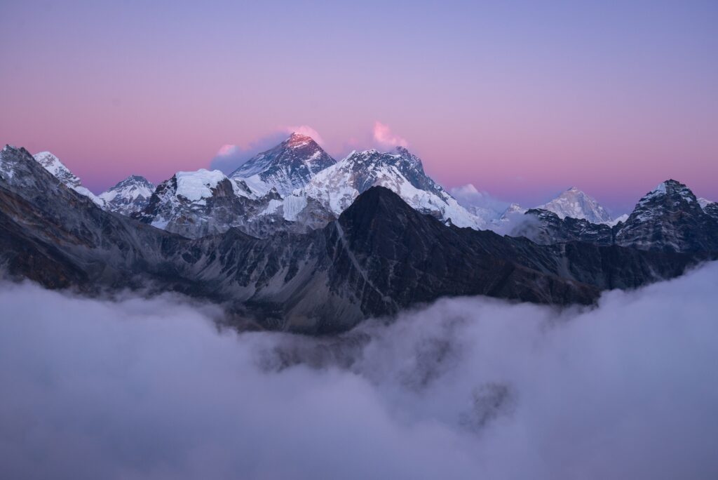 Snow-covered Himalayan peak glowing at sunrise